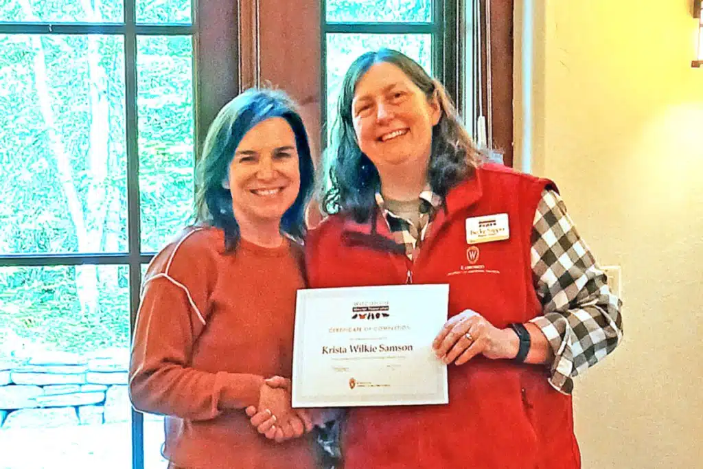 Krista Wilke Samson receives her Master Naturalist certificate from Becky Sapper. director of the Wisconsin Master Naturalist Program through UW-Madison Division of Extension.